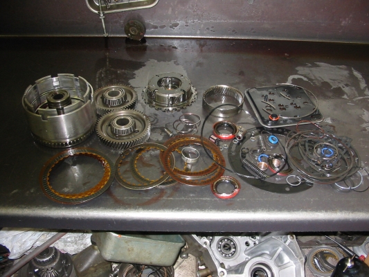 Old parts, 19 clutches, 6 "hard" parts, 3 bushings, 2 snap-rings, 2 filters, 3 springs, 2 valves, 47 seals and gaskets - Torque converter not shown because it was returned for core at purchase time
